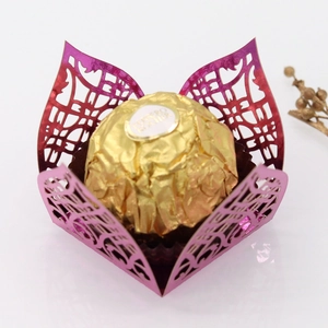 Macro shot of laser-cut petal design candy holder in metallic pink and purple gradient finish