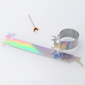 Detail of Christmas reindeer paper napkin rings with iridescent laser mirror finish