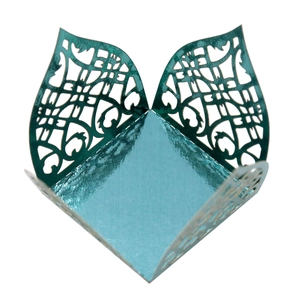 Detailed top view of laser-cut teal gift box with intricate European floral patterns
