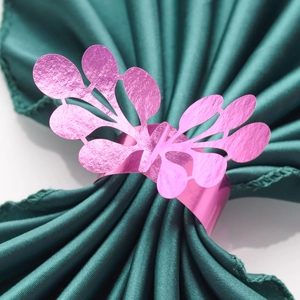 Detail of pink glitter butterfly paper napkin ring with hollow carved pattern design