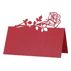 Detail view of red rose laser-cut wedding place card with a delicate pearlescent finish