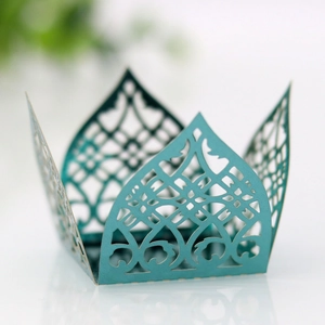 Detail of laser-cut European floral patterns on tiffany blue wedding candy box