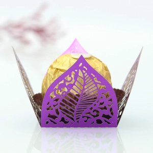 Detail view of laser-cut purple hollow leaf pattern on mirror paper chocolate gift box