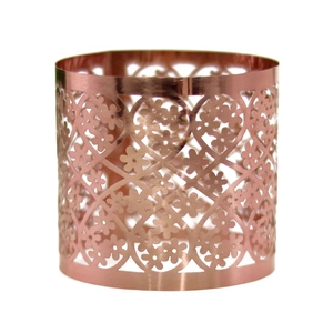 Detailed view of rose gold hollow floral napkin ring with laser cut pattern