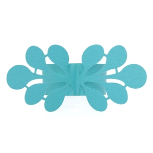 Detailed close-up of laser-cut turquoise butterfly paper napkin rings for wedding decor