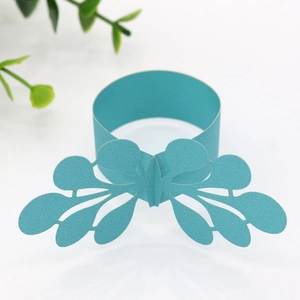 Detailed laser-cut Tiffany blue paper napkin ring with intricate hollow butterfly wings