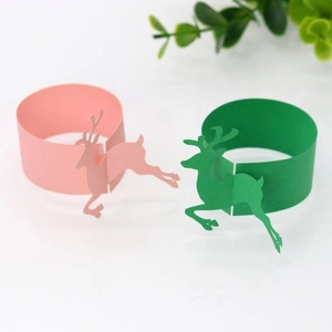 Christmas reindeer paper napkin rings in festive pink and green decorative elk cutout design