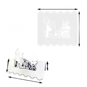 Detailed laser-cut white wedding place card featuring Mr & Mrs Love silhouette and dimensions