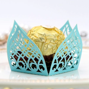 Close-up of laser-cut light blue floral lace wrapper for chocolate wedding favors