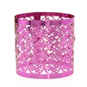 Detail of rose pink lace napkin ring with laser-cut hollow heart and flower patterns
