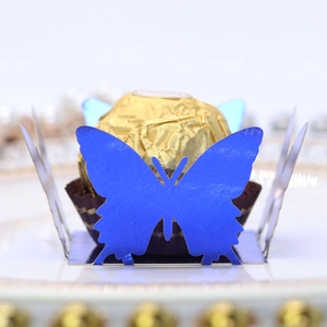 Close-up of laser-cut royal blue 3D butterfly candy box with hollow lace details