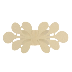 Close-up of laser-cut pearlescent paper napkin ring with elegant lace floral patterns