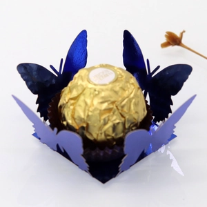 Detailed macro view of laser-cut butterfly chocolate paper wrapper in metallic blue