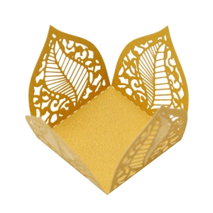 Detailed laser-cut gold pearlescent paper candy box with hollow leaf patterns and metallic finish