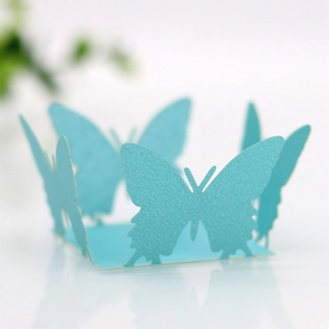 Macro view of light blue pearlescent paper butterfly cutout for party favors