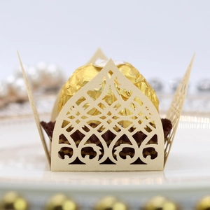 Detailed laser cut beige favor box with intricate floral patterns for single chocolate