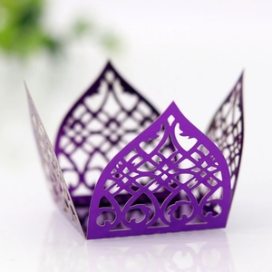 Macro detail of laser-cut purple hollow pattern on elegant lace wedding favor box