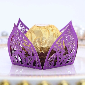 Detail of laser-cut purple butterfly chocolate holder for wedding party decoration