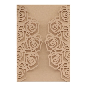 Detail of laser cut rose flower invitation cover with elegant champagne pearl texture
