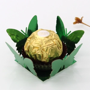 Detailed laser-cut butterfly chocolate wrapper in metallic green with hollow wings