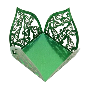Detail of dark green laser-cut butterfly candy box with metallic pearlescent finish