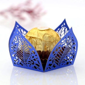 Detailed laser-cut hollow leaf design on deep blue paper wedding chocolate gift box