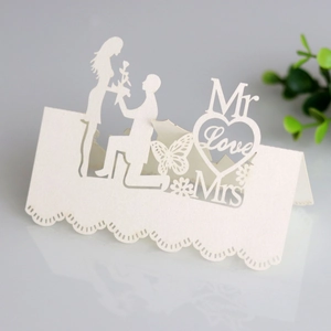 Laser-cut wedding place card with romantic silhouette and elegant hollowed patterns