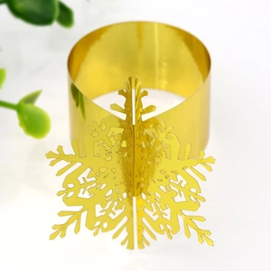 Detail shot of golden 3D metal snowflake napkin ring for Christmas table decor
