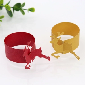 Detail showing red and gold Christmas reindeer napkin rings made of premium paper