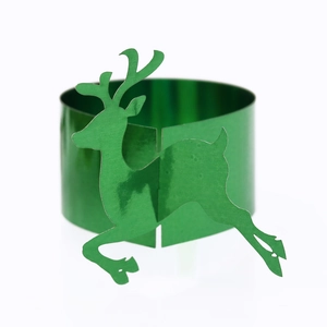 Close-up of green mirror finish reindeer paper napkin rings for Christmas table decor