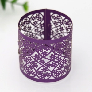 Detailed laser-cut dark purple paper napkin ring with intricate floral heart pattern