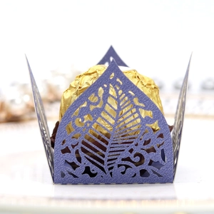 Intricate laser-cut purple pearl paper chocolate wrapper with leaf pattern detail