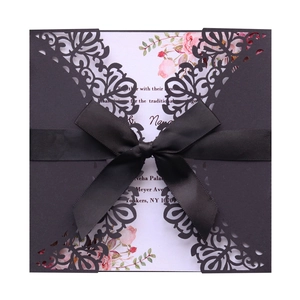 Laser cut invitation card with black hollow sleeve, silk ribbon and floral insert
