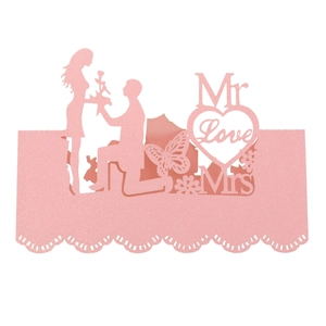 Detail of pink glitter laser-cut card with Mr & Mrs love heart and silhouette design