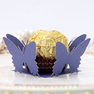 Navy blue pearlescent paper laser-cut butterfly chocolate holder for party favors