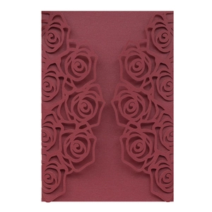 Macro detail of laser-cut burgundy rose patterns on high-quality cardstock envelope