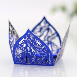 Detailed laser-cut butterfly hollow pattern on blue paper gift box for weddings
