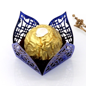 Detail of laser-cut wedding candy box with floral patterns in metallic electric blue