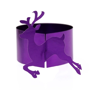 Detail of purple metallic deer napkin rings featuring a laser-cut reindeer silhouette design
