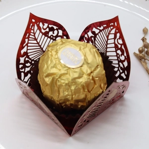 Detailed laser-cut red hollow leaf pattern chocolate gift box with gold floral accents