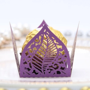 Macro shot of laser-cut purple paper chocolate box with delicate leaf vein pattern