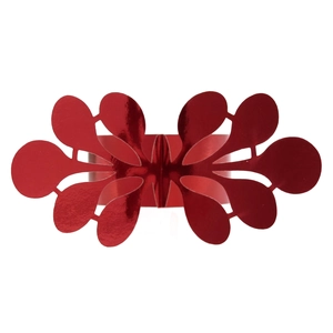 Macro detail of red glitter napkin ring with symmetrical floral hollow-out pattern