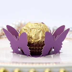 Detail view of purple hollow butterfly chocolate holder on a luxury porcelain plate