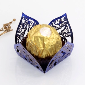 Detailed laser-cut butterfly chocolate holder in deep blue pearlescent paper