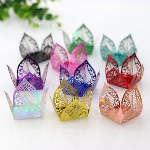 Detailed laser-cut vine leaf patterns on metallic favor boxes in various vibrant colors