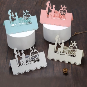 Laser-cut wedding place cards featuring 3D heart and Mr & Mrs silhouette in multiple colors