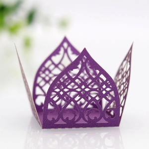 Detailed laser-cut geometric pattern on a premium purple pearlescent paper favor box