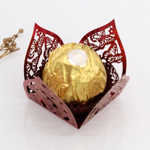 Laser-cut red butterfly chocolate holder with intricate hollow patterns and metallic finish