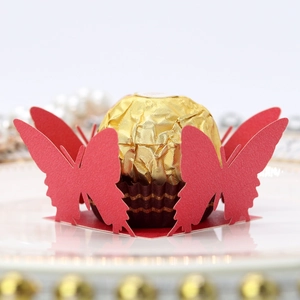 Detailed laser-cut red butterfly candy box with lace pattern for chocolate decoration