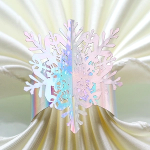 Macro view of holographic snowflake napkin ring with laser-cut iridescent finish detail